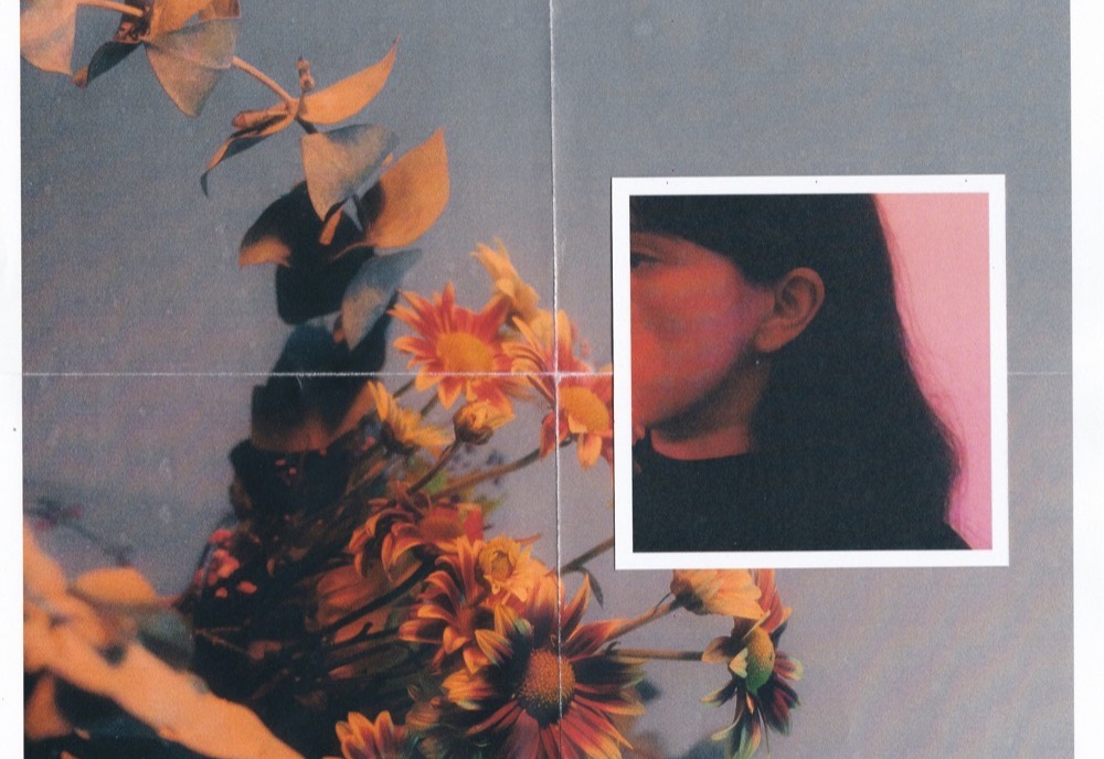 A film-photo collage of a portrait layered with dried flowers.